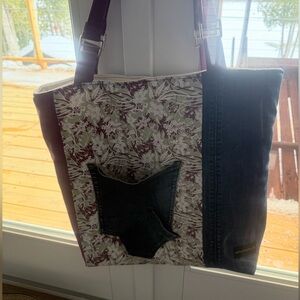 Handmade quilted tote 14x15x4. Zipper outside with inside pocket.Can make custom